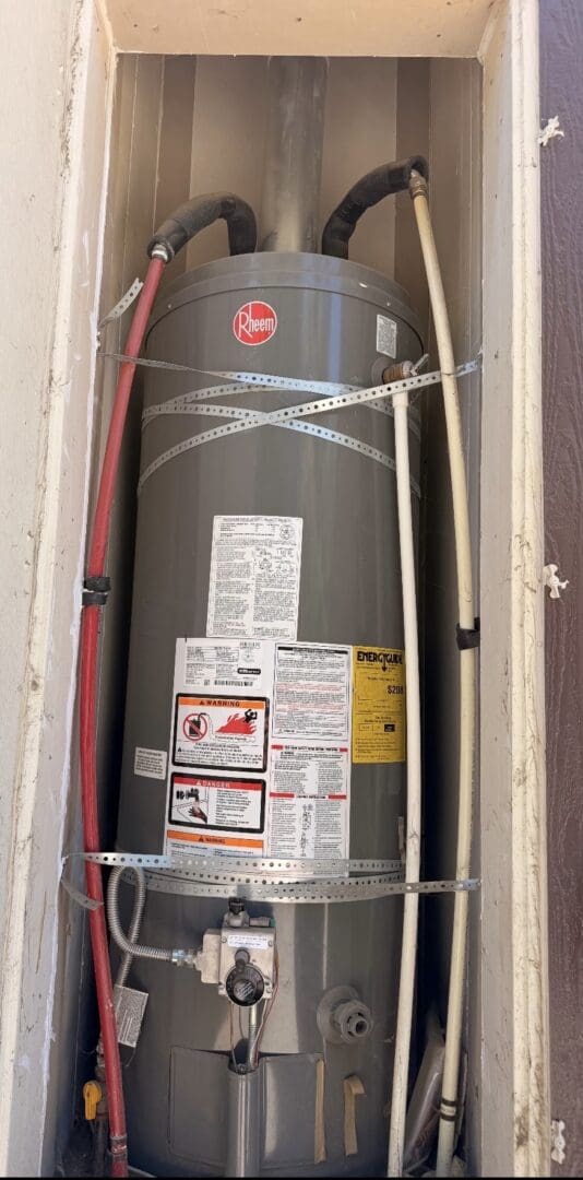 Old tank-style water heater before replacement in Wildomar California