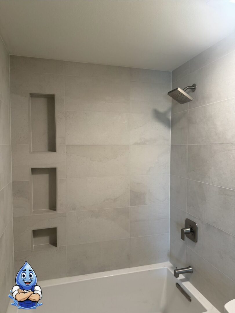Modern bathroom remodel completed by Hydro Plumbing in Murrieta, CA featuring a brushed nickel bathroom faucet and new vanity installation.