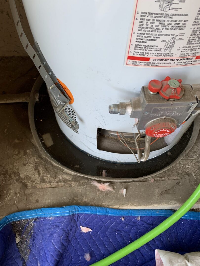 Failed leaking residential water heater requiring emergency plumbing service in Murrieta California